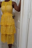 This dress caught my attention online because of the gorgeous bright yellow and the eyelet lace, which is always a favourite fabric of mine. 
It did not disappoint. 
I typically wear XS at Lulus and that's the size I ordered. But beware the waist has NO give. So my 32DD bust and 25/26 inch waist just barely allow the zip to close in the rib cage region...the rest zips easily. Perhaps a size small would be more convenient.  But that's no fault of the dress and I'll be keeping it since its not dreadfully bothersome to me.
Quality is great and the lining is modest. Sure to be a favourite for a few years to come. - Barbara H.
