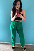 Okay, they fit nothing like the model, but that's because I'm really short!! The color is very vibrant, perfect for spring. They fit a little loose at the waist, but the belt helps keeping them up. - Vanessa S.