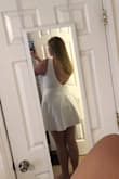 The fabric of this was nice and stretchy. It felt comfortable and has a slip underneath the skirt which was nice. The neckline was a bit lower than the pictures with the models showed and that was really my only problem with it. - Sarah B.
