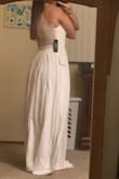 I like this dress and I purchased it for my bridal shower. I'm still on the edge of whether i'll wear it or return it. My only hesitation is that the front is sort of plain and I don't really like how I look in white. Other than that, the back is beautiful and it fits nice. The dress is just super long, but I think that is normal for many Lulus dresses. - Lauren M.