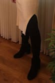These boots are really comfortable and they stay up around the knee with a slight amount of slouch throughout. I can only wear them with leggings and not over jeans, but that's not a dealbreaker for me since you can pair them with any dresses or shorts. - Lisa S.