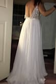 I saw this dress and all the reviews and thought that's how I'd like to look on my wedding day. I ordered two sizes unsure of which would fit better. The 6 came and it fit so well. I look so nice I actually was speechless (rate for me). I can't wait to marry my best friend and see his reaction to me in the dress. I will obviously have to have it shortened and the idea of a bustling option has come up as to how in the skirt. But it's so beautiful. It is very heavy though so hanging it has become a snafoo. Decided to lay in flat for storing it. - Molly O.