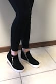 I assumed they were a typical wedge where they are teller in the back then the front. These have flat with no angle "wedge". They do have a lift of 1" on the bottom. Comfy and cute to wear with jeans or leggings for an athleisure look. - Mandi Y.