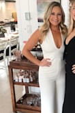 I want to purchase this jumpsuit in every color! I'm 5'3'' so I had to get it hemmed but that is always expected with my height. I was able to wear spanx even with the open back so that was sooo clutch. It does fit snug around the mid section but the fabric is stretchy and so comfortable that it doesn't show too much. - Samantha P.