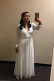 Good quality materials. I ordered medium which was the wrong size because it was too big and I had to get it fixed. I think a small or extra small would have worked better. It was a beautiful dress for my wedding at the court. A couple of girls made compliments about my dress that day. - Sandra T.