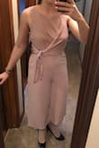 I always struggle with finding jumpsuits that fit, but this was too cute to pass up! I ordered a small and a medium. The small was definitely too little! The medium fit well, but just looked awful on me! Didn't flatter my curves and made me look larger than I am! This is definitely for a more petite lady. - Emily H.