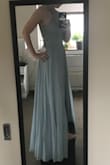 I bought this dress as a bridesmaid dress for a friend's wedding, and it was my first time shopping at Lulus. The dress came in perfect condition, and I was incredibly impressed by the dress fit, material, and just sheer quantity--it's a LOT of dress! It moves beautifully and the color is exactly as shown. I'm 5 ft 1, so obviously the dress was quite a bit too long on me as you can see in the picture, but I'm used to getting dresses hemmed so this wasn't an issue for me. - Julia B.