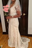 I ordered multiple dresses from different websites, but this one fit like a glove. It looked very elegant and I got lot of complements. Even though it says White dress, the inner lining is ivory and it reflects just a little bit through the lace. The dress looks something between white and ivory, very unique color which I loved too. - Shraddha N.