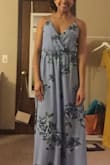 The open back has adjustable straps which is my favorite part of this dress. There is a lot of fabric so it feels a bit heavy for someone my size and will need to get it trimmed due to the long length. It's a pretty blue with beautiful flower prints! - Joselyne H.