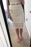 I bought this for my bachelorette party and I'm so happy with it! The top has a zip on the side so it won't stretch when you put it on/take it off. - Marisa S.