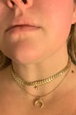 I like this necklace in theory. The chevron looking choker is a necklace in itself and really cute but doesn't lay completely flat. And the other necklace is a combo of the stone and crescent but it's very tight on my neck. I will likely have to buy an extender to wear it comfortably. - Sarah W.