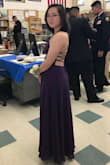 I wore this dress for a military ball. I got so many compliments and everyone loved the back. The color is a nice and rich purple, it might show a different shade depending on the lighting. You can tell it's made out of high quality material because of the weight of the dress. Due to my height it was excessively long, I cut about 4 inches off the bottom, wore 2 inch heels and the dress was right above the ground. I got away without wearing a bra, it's preferable if you got the sticky cups. If you are petite, you should get this dress ahead of time to make alterations. Beautiful dress!! - Sandy S.