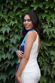 I wore it for my college graduation and it fit perfectly. I loved how the back is open but doesn't go too low. Also, it's good material; Not see through whatsoever. - Stephanie R.