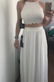 I am a 30E, and a 24/25 waist in pants, with a pretty straight torso below my chest. I selected a small after reading reviews and was surprised at the way this fit. I expected the chest to fit and the skirt to be large - it ended up the other way around. Even with the straps cinched to the neckline and the back laced as tight as possible, the top was still large and fit loosely for me. It looks okay, but really accentuates my bust, and looks loose by the way the top doesn't cling to the upper part of my chest. This just may not be the best fit for someone with a large chest and small rib cage. - Chelsea T.