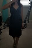 This dress is very nice. It fits well in the top and is a good midi length. It is tight in the hip area. If you are a pear shape I would not recommend. - Jenelle P.
