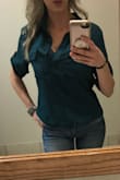 Beautiful green color.  Great fit and comfortable for the office.  Great to tuck in or leave un-tucked.  I purchased 2 in different color because I love so much.  Material is not sheer at all so no need to wear an under shirt.  I am wearing a lace bralette to cover my cleavage for the office so I don't have to button it all the way up. - Mandi Y.