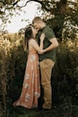 I wore this dress for my engagement pictures and I loved it! Fit super well, material was thick enough to get away without wearing a bra. The high low was nice because I didn't need to get the dress hemmed. I wore some tall wedges with it and it was perfect! - Dana L.