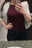 Love this body suit!! It's so comfortable and goes with anything. I don't agree with a previous review that it's thick enough to wear without a bra. It's pretty thin material. I wear a bra with it and you can't see it in the back. - Jovana M.