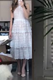 Love the structure to this dress, the higher neck and the heaviness of the lace. Makes this dress very flattering and hides things well. A more conservative dress option that is still really cute! Really into the midi length/tea length and the pattern of the lace too. - Rachel H.
