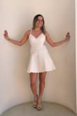 I love this dress so much. I needed a white dress for my sorority, and I fell in love with this one. It is so flattering, comfortable, and the back is adorable. I would highly recommend! - Paulina B.