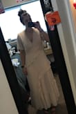 I love love love this dress! It is so adorable- BUT it runs huge! I have a bigger bust, so a medium usually fits me. This dress was much larger than expected. The chest was very baggy and was not much of a maxi dress rather than a midi. I have a smaller waist compared to my bust, so it may be different for someone who has less of an hourglass shape than I do. I absolutely loved it and wanted to wear it in my engagement photos, so I decided to have to tailored. I had the chest area tightened and waist taken in so it is a more fitted look. I absolutely love it now! I can't wait to wear it for my pictures. As mentioned in the other reviews it is more of a skin color material with a little pink in it, but it dies photograph more white! *disclaimer- I would have returned and gotten a small, but my photos were a week from after I got the dress, so I would not have gotten it in time, hence me getting it tailored.* In the photos I have the before and after getting it tailored. :) - Lydia B.