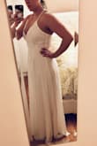I was between a medium and large, I ended up ordering both and the Medium fit perfectly! It was a tad long, but other than that, no alterations needed. This was one of my choices for a wedding dress to elope in. I loved that it was light and easy to move in, but ended up going with another dress in the end. It is beautiful though and highly recommend! - Ashley M.