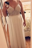 This was one of four Lulus dresses I ordered for my elopement. All of them have been so beautiful that the decision was hard! This dress was a favorite if I was having a traditional wedding. The beading and quality are outstanding! The only alteration I would have needed was to shorten the straps. I loved that this one already had cups sewn into it as well. I will be adding them to the one I chose thanks to knowing the difference it made with this one! - Ashley M.