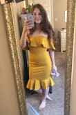 Just a classic style for the derby and a really fun color!! It is more mustardy/golden yellow than a true yellow. I still love it though. The waist didn't bunch on me like some reviews said, but I did feel it is a bit loose. I probably could have also gone for a XS because I have a smaller chest, but I will enjoy the extra space, having to walk around all day. Overall, great quality. Feels sturdy and supportive. - Brittany T.