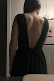 I absolutely love this dress! I'm 5'8" so most dresses are too short for me but this one perfectly hits the ground. I won't need any alterations. There's grips on the straps to prevent it from falling. It's a little tight on my ribcage so I'll need help zipping it but other than that I'm obsessed with this dress! Also the slit really only shows if you stick your leg out! - Delaney S.