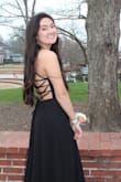 The material was comfortable and breathable! I wore this dress to prom and had a great time with no concerns about sweating the night away. It's obviously a very open dress and the strappiness of the back allowed for something extra to the dress. The size was great, adjustable all over but its an extremely long dress as well. Nothing a little carrying couldn't fix whenever I walked. Overall I absolutely loved it and got many compliments throughout the night. - Olivia F.