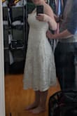 The material and the design of the dress is awesome! I am absolutely in love with it. I bought it for a casual BBQ we are having to celebrate my wedding with some extended friends and family we couldn't invite to our very small ceremony. As you can see, it does need to be tailored a little. The straps are way too long for my comfort. I'm a 32H so I can't show as much cleavage as someone with a smaller chest might be able to. Even so half of my bra was showing without my fiancee holding the dress up for the picture. It is also a little big around the waist. In the picture I am 147lb, 38 - 29 - 38 in terms of hips, waist, and chest. My fiance is probably holding on to an inch of fabric from each strap, and about an inch around the waist. It is not a stretchy fabric, so I don't know if this would warrant. - Carolina M.
