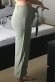 So these pants really are fantastic, the color is cool and would look great with a number of tops. I ordered these as part of a Lulus haul for an upcoming trip to Italy. I wanted lightweight pants as an option to just wearing dresses and skirts. These fit the bill! The label says 100% cotton but they feel like linen almost. The tie belt is great, but depending on what sort of outfit I'm wearing the pants with, I might even remove it (it's not stitched in so you can take it off). My ONLY qualm about these pants is that they run BIG. I've also recently lost a good amount of weight so I'm sort of trial and error-ing how things fit me now. I've attached pictures but there is a pretty big gap around my waist even when wearing the belt. I originally ordered a size 6 but I'll be exchanging for a 4! I'm hoping the 4 isn't too small (these pants do have a stretchiness to them) and that they'll survive after a wash. I have an hourglass shape and the 6 wasn't snug on my butt so I'm hoping the 4 won't be either! - Alannah S.