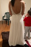 This dress is perfect! I was nervous ordering my wedding dress online but I'm glad I did! Great quality, you would think I spent thousands. The bottom half is very flowy and it's not see through which is great, it's lined. I don't think I'm getting any taken off the bottom, I like the length. If you're looking for a beautiful wedding dress on a budget this is perfect! - Shameria O.