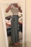 This skirt will be a great summer/spring staple. It's light weight, but not see through at all. I am typically a large in Lulus dresses (but a medium at other stores) so I went with a large and it fit perfect! There really isn't much stretch in the waist and there is zipper, the tie is just for looks. I am 6' tall so the dress doesn't hit the floor, but I didn't expect it too and planned for more a midi style. I paired with a crop top and it looks great! - Morgan C.
