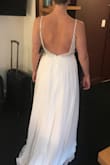 This gown is lovely. The beading and detail in the top has a nice heavy and luxurious feel to it. The skirt is flowy and lined well. I purchase to try on along with several other gowns, and decided on a different style that was simply a bit more mature. I did feel this gown has a bit more of a prom-dress feel than wedding dress... I'm in my 30s and wanted a bit more classic elegance but did really love this gown as well. The sheer paneling in the front is a bit distracting with a very small bust, but it could potentially be altered and just fitted differently to accommodate for smaller chest size that doesn't need the cleavage coverage. - Whitney W.