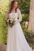 I really did love the sleeves and back of this dress. I added cups to the bust and took it in a bit to make the bust look fuller. I also got an attachable train to make it longer. Being so inexpensive it's an easy dress to customize. - Claire C.