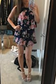 This romper is so fun and flirty. It is very soft and comfortable to wear all day. I love the fabric and the floral design. It is on the shorter side but I don't mind that at all with me being on the shorter side myself. It hits me at the perfect length and the shorts are flowy enough that I don't think the length would ever be an issue. Love it! - Cara R.