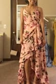 This dress is stunning! I wore it to a Scottish beach wedding and received so many compliments. It's flowy with tiered ruffles for a romantic look. I'm 5'3 and even with 3" heels I had to get it altered. The XS was very fitted around the waist area but if I sized up to the S, it was loose fitting elsewhere. Overall I recommend! - Joselyne H.