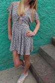 I am 5'3 and 100ish pounds. Finding clothing that fits me well is always a struggle. HOWEVER, I was so pleasantly surprised by this romper. I had high hopes after seeing it online, but the romper exceeded my expectations. I got many compliments on my outfit. I was initially worried about the tie area in the front, but I was able to wear a strapless bra. This is definitely a great choice for petite girls! It is so flattering! - Anita G.