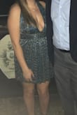 I ordered this dress for a fraternity formal. Definitely shows a lot of cleavage for a large chested woman. I ended up having to twist the straps right in the back to have a good fit. Material is shimmery and perfect for holiday cocktail events! - Ashley G.