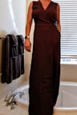 The color of this jumpsuit is what first sold me. Then I got it in the mail and was thrilled with the cut on top and the "faux-dress" front look that the bottom has. It's great with a pair of pumps on for me; or toss on a sweater or blazer and head in to the office.
I'm 5'0" so it's a bit long, most things are. A simple trip to the tailor to get a hem and I'm going to be in style for spring. - Ashley H.