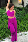 I wore this outfit for a beach vacation and I love it! The bottoms were a tiny bit tight around the waist- I wish I could have gotten an XS top and just a small bottoms. The slits go very high up on your leg especially when you walk but if you're monitoring it, it's not bad. Loved the color too, so vibrant. The perfect vacation piece. - Emily H.