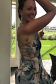 This dress fits like a dream. Absolutely lovely flattering dress for spring and summer. Fits nicely around the bottom and back and flows from the hip. Love the back lacing detail and pretty pattern. Perfect for a brunch, a day or evening party, a special occasion or vacation dress. - Simcha M.