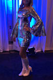 I bought this dress for a charity disco event and received so many compliments! I was sparkling as much as the disco ball that night! There is NO stretch to this dress. I am usually a size small and if fit perfectly, but if you are in the fence I would size up as there is no give to this dress. - Andrea S.