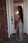 This dress is true to size and fit my 16 year old perfectly. She's wearing an extra small. Beautiful dress for prom. - Wanetta S.