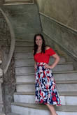Very comfortable material! The red is vibrant in a great way! I've worn with jeans and I've worn with a skirt! Can be work more like a t-shirt or off the shoulder. - Samantha M.