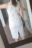 Bought this dress for a my bridal shower. When I put it on I felt like I was going to a business meeting. The tan was nice below but I felt it took away from the lace. Dress is much longer in person. I'm 5'6" and it was well past my knees. I was worried about the slit in the back, felt if I bent over someone would see my underwear. Decided to go with another dress since this one didn't fit my event. - Angelina S.