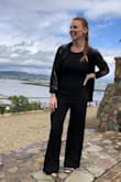 I am usually very hesitant on buying rompers or jumpsuits due to my height and torso length. However, I made the jump (no pun intended) and bought this one. I must say I'm really happy I did! 
I have a more muscular build and was a little hesitant on purchasing the large. I had taken my own measurements (hip, waist, bust) and they matched up most to the large so I went ahead and bought it and it ended up fitting p.e.r.f.e.c.t.l.y. 
The only downside, depending on who you are, about this romper is the leg length (Hence the 4 stars and not 5). I'm 5'-9" and wore 4" heels and the hem just made it off the ground. Other than that, it was perfect! - Hannah S.