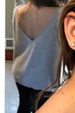 I love this sweater. I have it in two colors! I always get compliments on it! Love the open back! I got extra smalls, and they are a little to big for me because the sleeves fall off my shoulder. Other than that, I love them! - Alivia C.