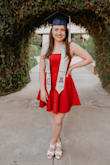 The material is heavy enough to not fly up but not hot. It hangs so nicely and is such a great color. I was wondering if it would feel too short but because of the material it stayed put! IT was perfect! I wore it for graduation photos and it is so beautiful and fit so well! My boyfriend LOVED it and I can't wait to wear it again!
I am actually going to order the exact same dress in blue this week! - Taarna D.